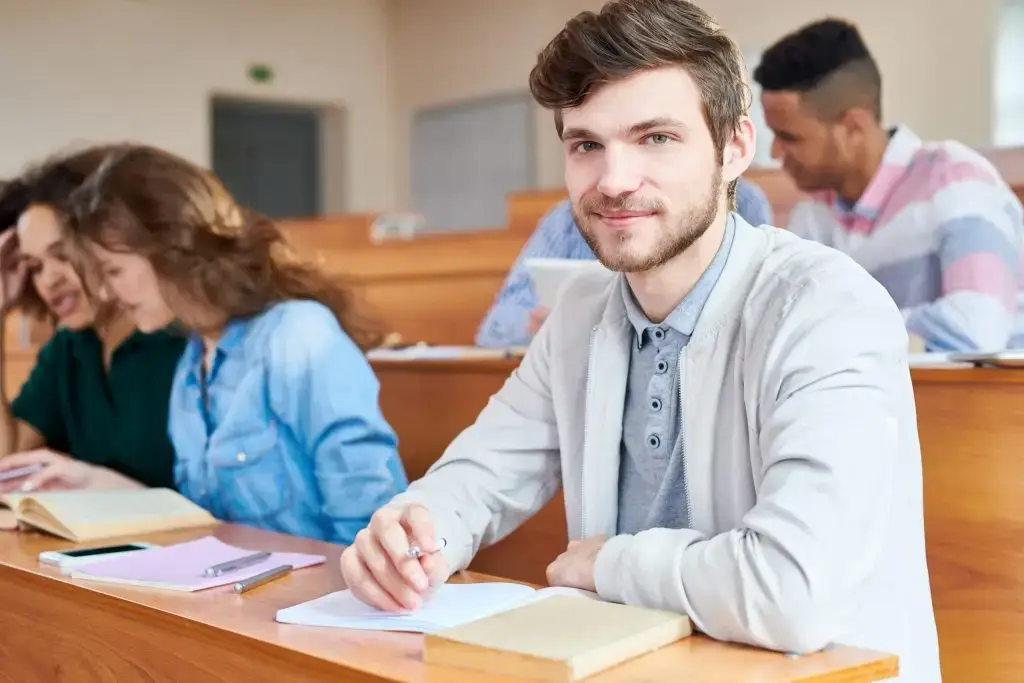 college student sitting at desk during a lesson
