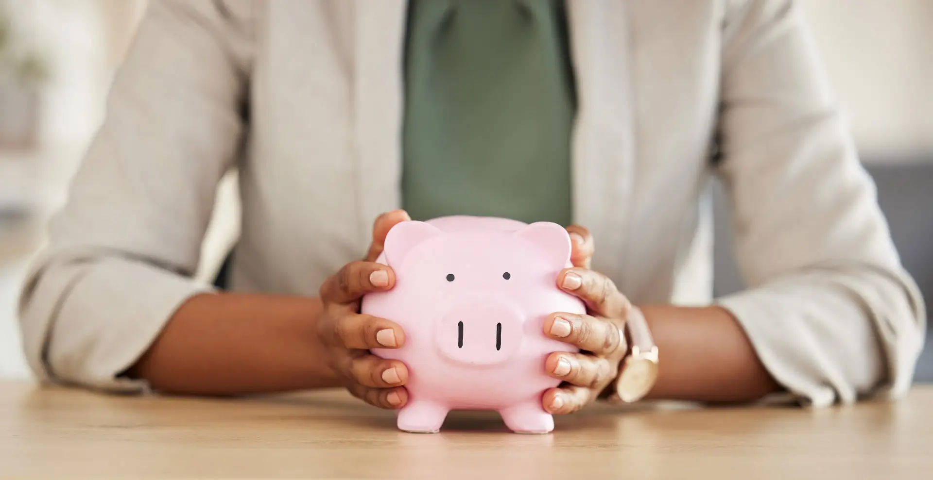 Closeup of a person holding a piggybank